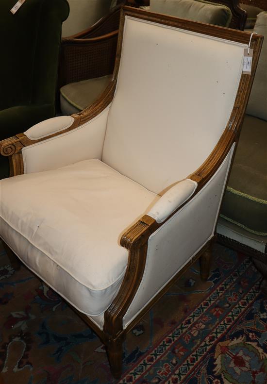 A French oak upholstered fauteuil